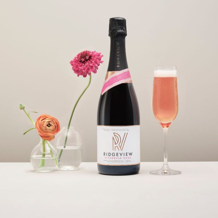 Fitzrovia Rosé, English Sparkling Wine bottle with glass, and flowers